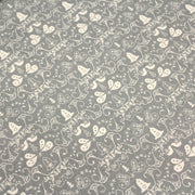 Tissu de coton de Noël scandinave aux cloches & arabesques écrues, fond gris - tissuspipi.com