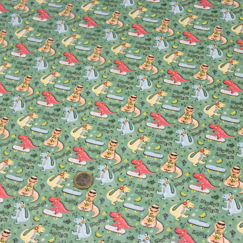 Tissu de coton Dinosaure music lover, fond vert sauge - Oeko - Tex - tissuspipi.com