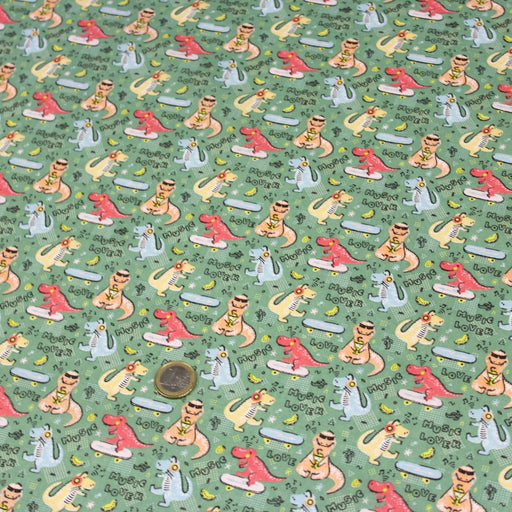 Tissu de coton Dinosaure music lover, fond vert sauge - Oeko - Tex - tissuspipi.com
