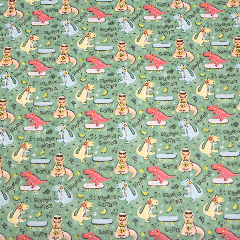 Tissu de coton Dinosaure music lover, fond vert sauge - Oeko - Tex - tissuspipi.com