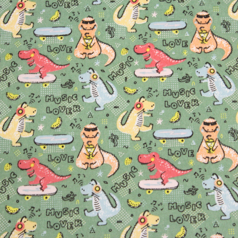 Tissu de coton Dinosaure music lover, fond vert sauge - Oeko - Tex - tissuspipi.com