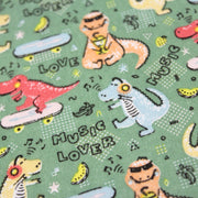 Tissu de coton Dinosaure music lover, fond vert sauge - Oeko - Tex - tissuspipi.com