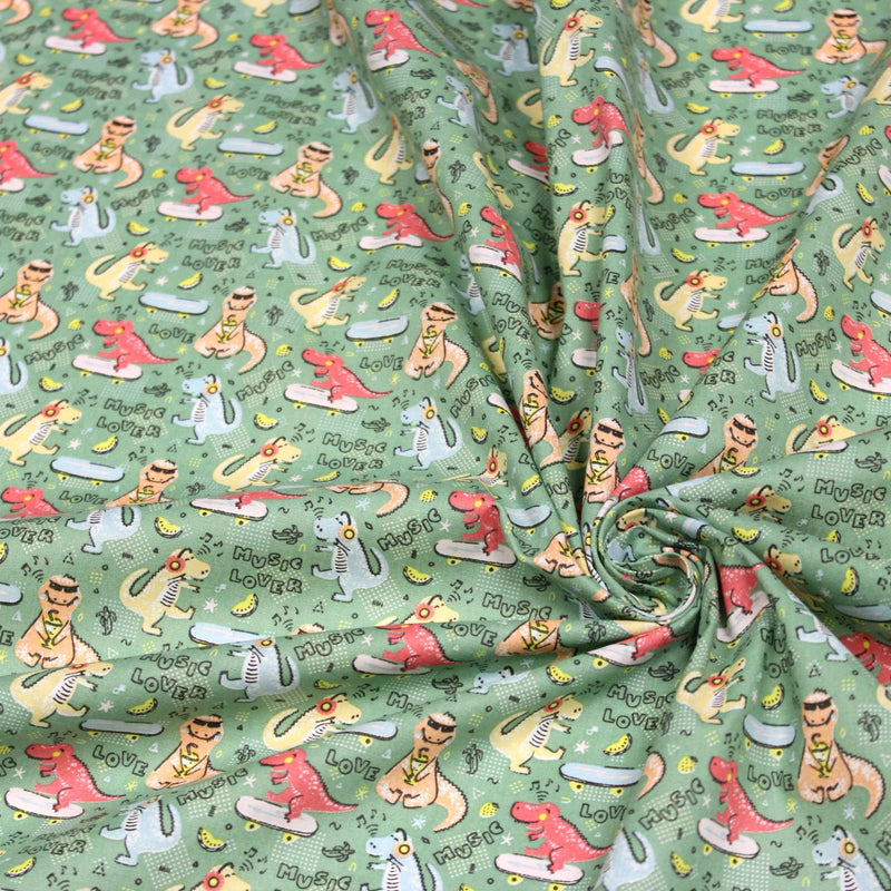 Tissu de coton Dinosaure music lover, fond vert sauge - Oeko - Tex - tissuspipi.com