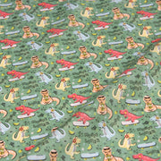 Tissu de coton Dinosaure music lover, fond vert sauge - Oeko - Tex - tissuspipi.com