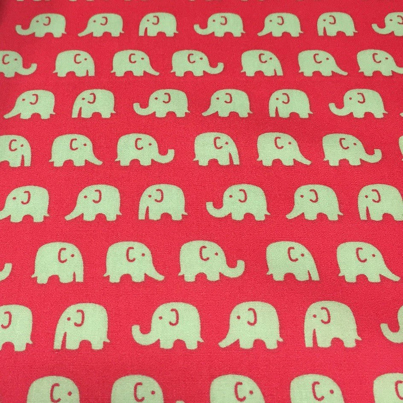 Tissu cotonnade rouge aux éléphants verts - tissuspipi.com