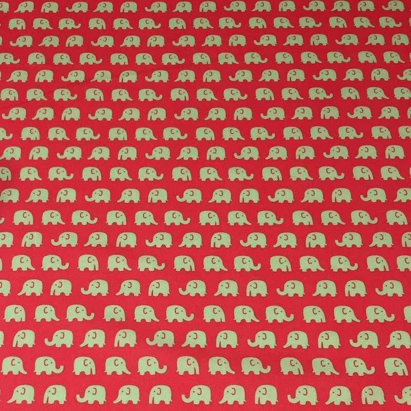 Tissu cotonnade rouge aux éléphants verts - tissuspipi.com