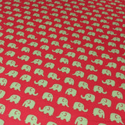 Tissu cotonnade rouge aux éléphants verts - tissuspipi.com