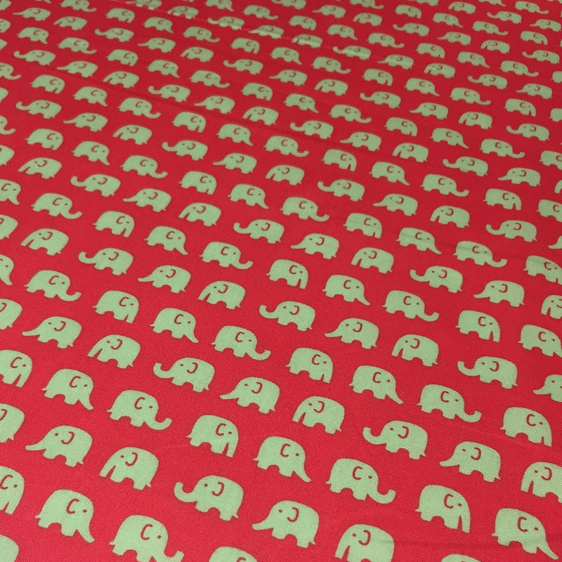 Tissu cotonnade rouge aux éléphants verts - tissuspipi.com